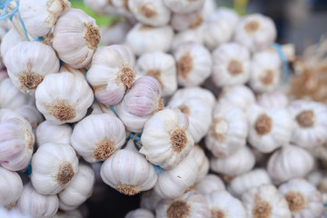 Closeup on garlic in sacks at market