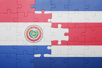 puzzle with the national flag of costa rica and paraguay