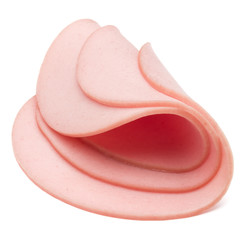 cooked boiled ham sausage or rolled bologna slices isolated on w © Natika