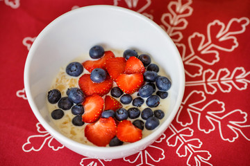 Hot oatmeal breakfast with fresh fruits