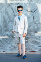 Little boy in a nice suit and glasses. Children portrait