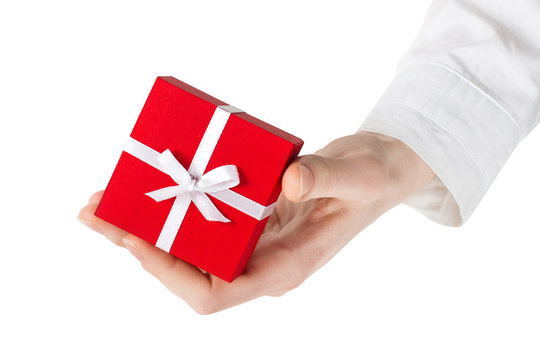 Woman hand holding a gift. clipping path