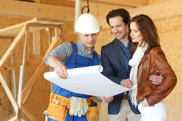 Worker shows house design plans