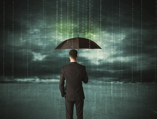 Business man standing with umbrella data protection concept
