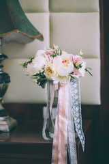 Colorful wedding bouquet in vase in bridal suite