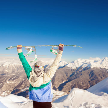 Sport woman in snowy mountains