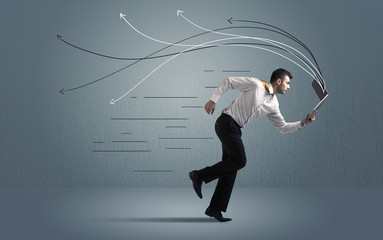 Running businessman with device and hand drawn lines