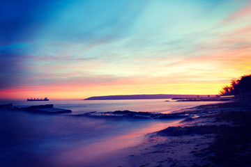 Obraz premium Sunset on the beach with beautiful sky