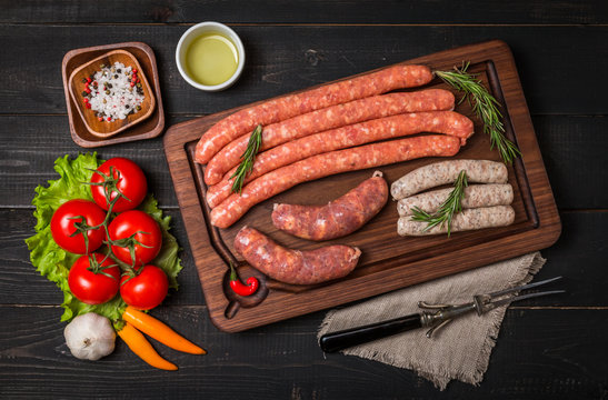 Raw sausage with spices and  vegetables