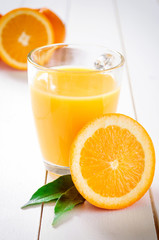 Orange Juice and orange fruit on white table