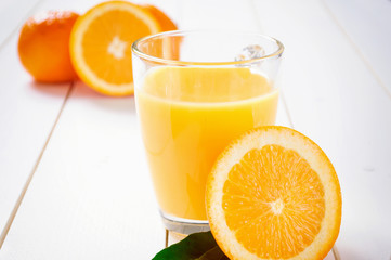 Orange Juice and orange fruit on white table