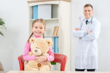 Little girl having appointment with her pediatrician 