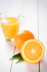 Orange Juice and orange fruit on white table