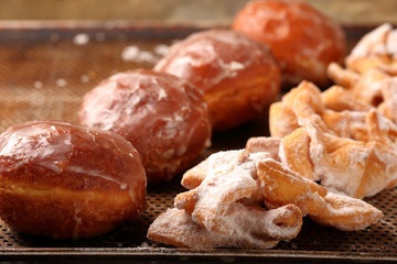 Donuts and faworki. Traditional Polish cookies on Fat Thursday - obrazy, fototapety, plakaty