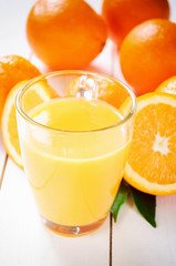 Orange Juice and orange fruit on white table