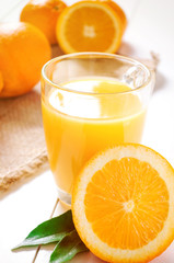 Orange Juice and orange fruit on white table