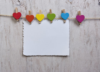 heart rainbow of colors on a white wooden background
