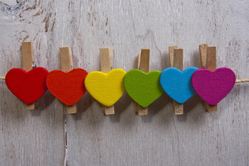 heart multicolored on a white wooden background.LGBT symbol