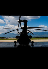 silhouette of a helicopter in the hangar