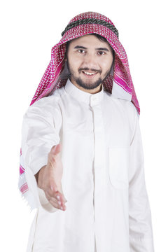 Arabic businessman offering handshake