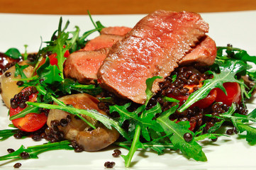 Delicious beef with lentil salad, vegetables and tomatoes