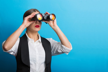 Business woman with a binoculars
