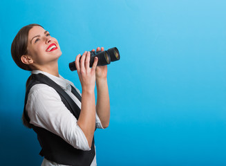 Business woman with a binoculars