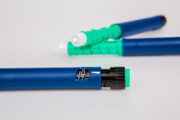 Insulin pen for diabetics on white background