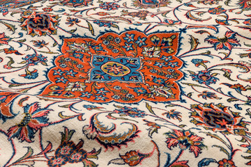 Close up of a fine floral motif persian Sarouk oriental carpet