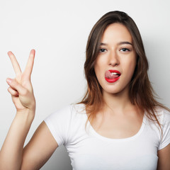 lovely woman showing victory or peace sign