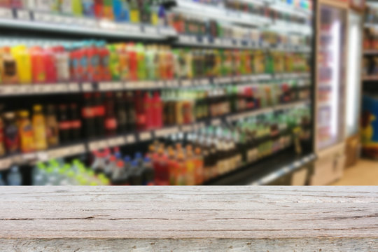 Empty table over blur supermarket with bokeh background, Product
