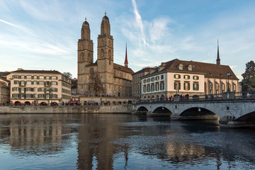 Fototapeta na wymiar Reflection of Grossmunster church in Limmat River, City of Zurich, Switzerland