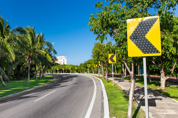 Road signs warning drivers for ahead dangerous curve