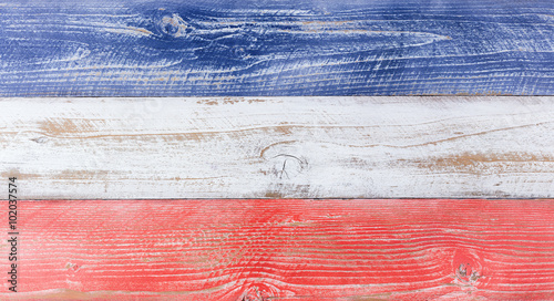 American national colors painted on fading wooden boards