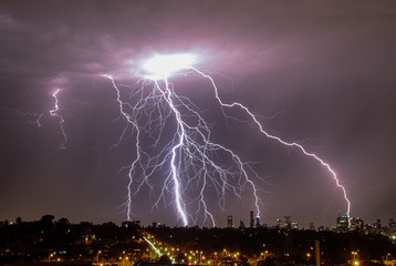 Lightning over city skyline