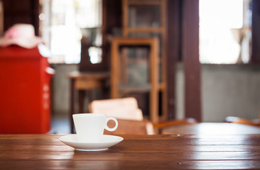 White coffee cup on wooden table