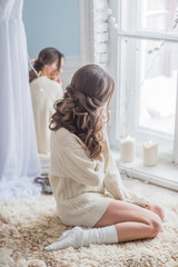 beautiful woman relaxing near window