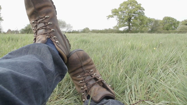 A Hiker Takes Off His Boots After A Long Walk