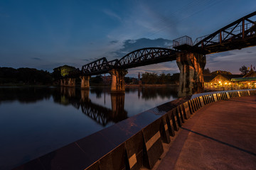 Fototapeta na wymiar The Bridge on the River Kwai at Kanchanaburi (Thailand) on sunset.