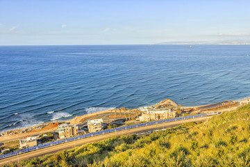 The sea, the beach and the blue train - top view