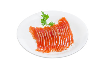 Sliced fillet of salted rainbow trout on a white dish