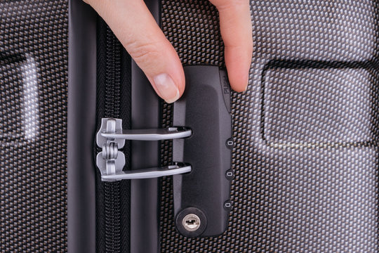 Hand opens suitcase combination lock