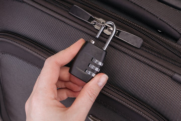 Hand opens suitcase combination lock