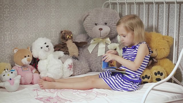 Cute kid girl playing with toy at home