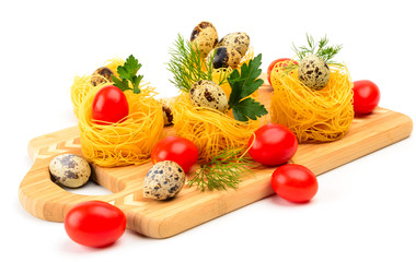 Pasta nests with cherry tomatoes and quail eggs.