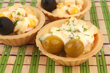 Tartlets with salad and olives