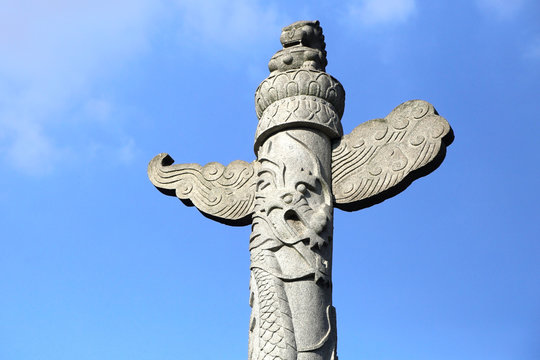 oriental stone pillar carving with dragon and lion of Wun Chuen temple, Hong Kong