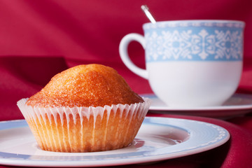 Cake and blue tea cup