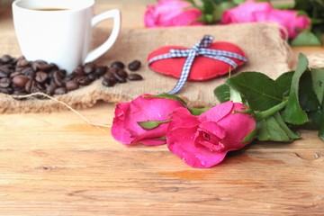 Coffee with coffee beans and red hearts.