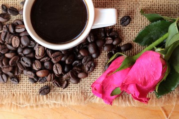 Coffee with coffee beans and red hearts.